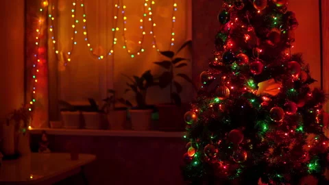 Decorated Christmas tree with flashing lights at home Stock Footage 144019572