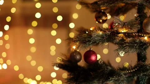 Decorated Christmas tree with glowing lights and balls on blurred background Stock Footage 166212435