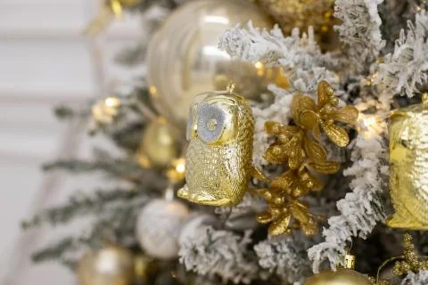 Decorated Christmas tree with golden patchwork ornament artificial gold and Stock Photos