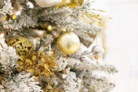 Decorated Christmas tree with golden patchwork ornament artificial gold and Stock Photos