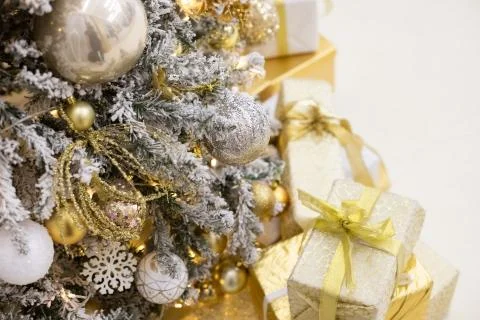 Decorated Christmas tree with golden patchwork ornament artificial gold and Stock Photos