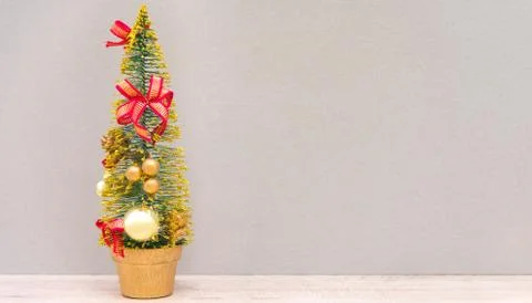 Decorated Christmas tree on a gray background Stock Photos