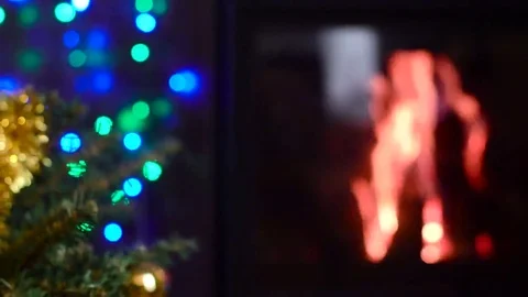 Decorated christmas tree with lights in front of fireplace Stock Footage 69298141