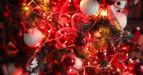 Decorated christmas tree with red blinking garland and toys, camera in motion. Stock Footage 144243471