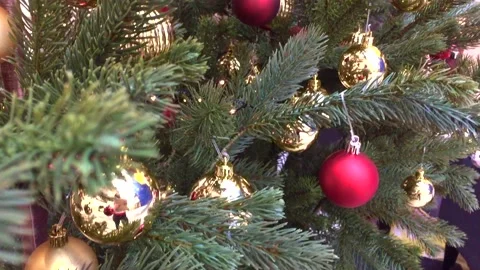 Decorated Christmas tree. Red, silver and green ornaments on wood. Christmas Stock Footage 144969717