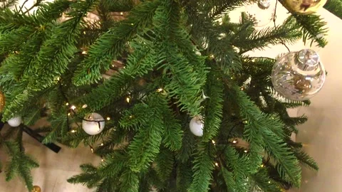 Decorated Christmas tree. Red, silver and green ornaments on wood. Christmas Stock Footage 144969813