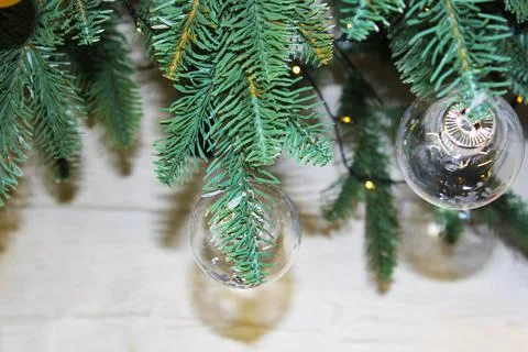 Decorated Christmas tree. Red, silver and green ornaments on wood. Christmas Stock Photos