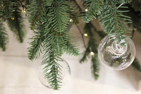 Decorated Christmas tree. Red, silver and green ornaments on wood. Christmas Stock Photos