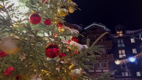 Decorated Christmas tree in a ski resort Stock Footage 337250613