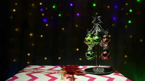 A decorated Christmas tree stands on a gift against a background Stock Footage 143570433