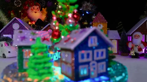 A decorated Christmas tree surrounded by bright houses and trees Video stock 294492066