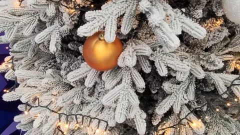Decorated Christmas tree with white, silver branches, gold, orange and white Chr Stock Footage 295108859