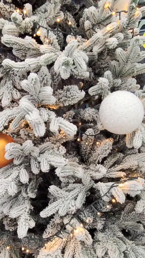 Decorated Christmas tree with white, silver branches, gold, orange and white Chr Stock Footage 295111067
