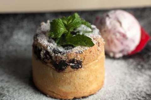 Decorated cup cakes, ice on table close-up Stock Photos