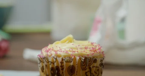 Decorated cupcakes on a table Stock Footage 117004871
