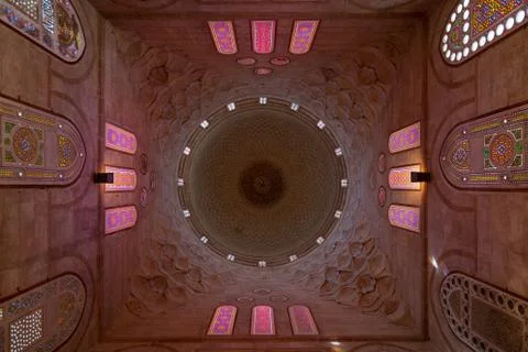 Decorated dome mediating ornate ceiling with floral pattern decorations Stock Photos