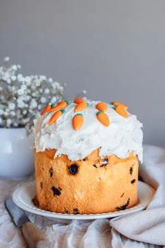 Decorated Easter cake panettone on linen table. Stock Photos