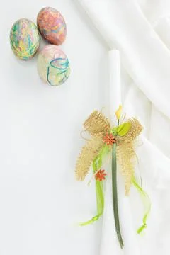 Decorated Easter eggs and Easter candle Stock Photos