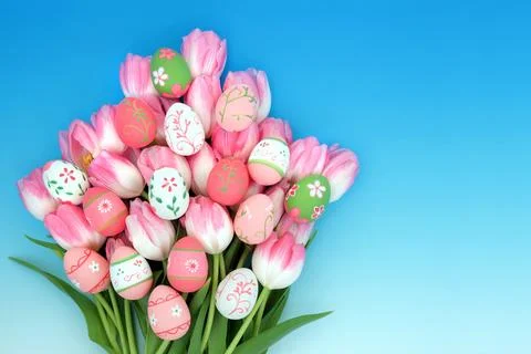 Decorated Easter Eggs and Pink Tulip Flower Bouquet Stock Photos
