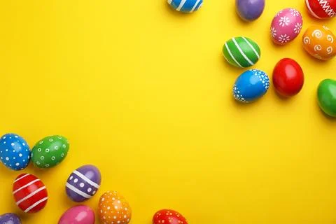 Decorated Easter eggs and space for text on color background, top view 库存照片