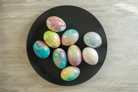 Decorated Easter Eggs on a Black Plate . Stock Photos