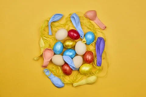 Decorated Easter eggs with colorful balloons Stock Photos