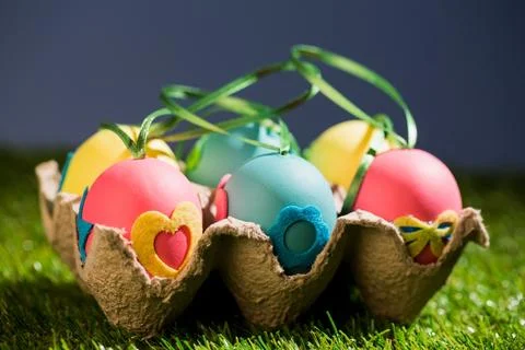 Decorated Easter eggs in crate Stock Photos