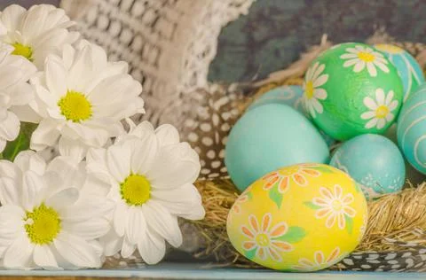 Decorated easter eggs with daisies Stock Photos