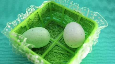 Decorated easter eggs fall into the basket Stock Footage 172470717