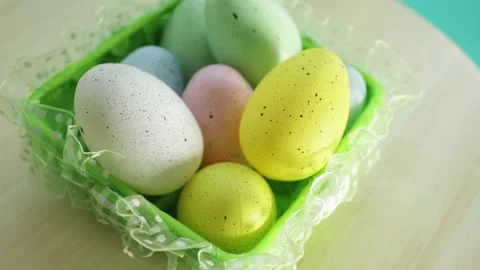 Decorated easter eggs fall into the basket, easter egg hunt Stock Footage 174149013