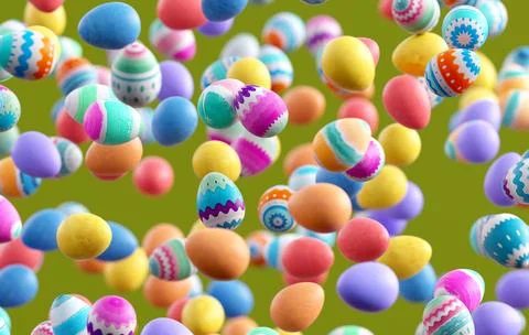 Decorated Easter eggs falling on green background, festive spring holiday c.. 库存照片