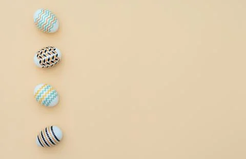 Decorated Easter eggs lie on the yellow background. Happy Easter holiday and  Stock Photos