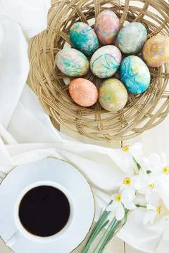 Decorated Easter eggs,coffee and flowers Poet's Narcissus flowers Stock Photos