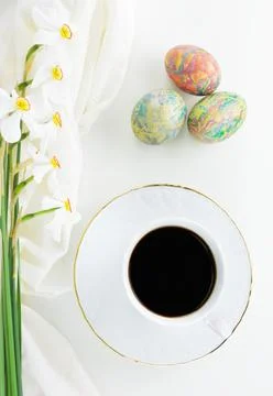 Decorated Easter eggs,coffee and flowers Poet's Narcissus flowers Stock Photos