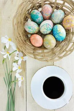Decorated Easter eggs,coffee and flowers Poet's Narcissus flowers Stock Photos
