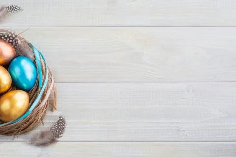 Decorated easter nest with eggs Stock Photos