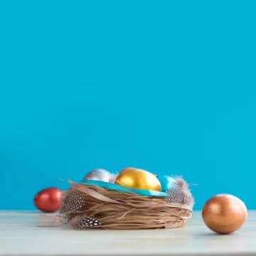 Decorated easter nest with eggs Stock Photos