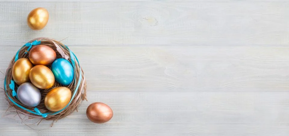 Decorated easter nest with eggs Stock Photos