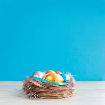 Decorated easter nest with eggs Stock Photos