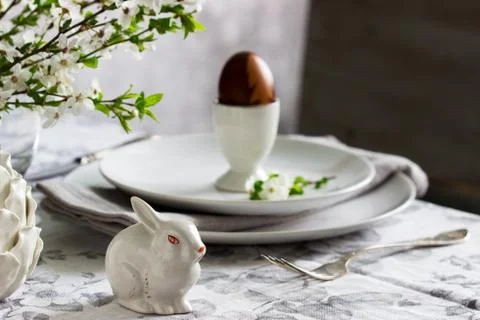 Decorated Easter table with blooming cherry plum. Stock Photos