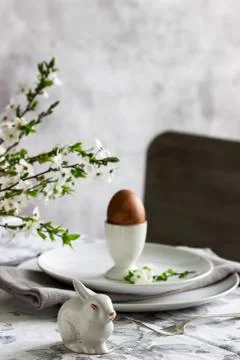 Decorated Easter table with blooming cherry plum. Stock Photos