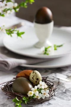 Decorated Easter table with blooming cherry plum. 스톡 사진