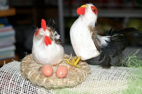 Decorated egg with chick inside a wicker basket Stock Photos