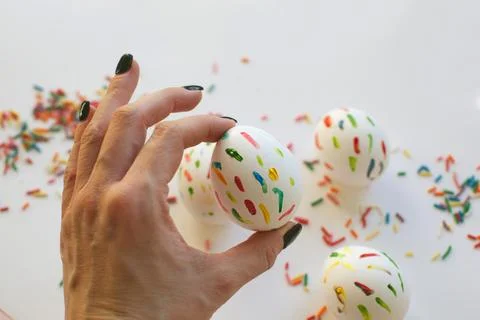 Decorated egg in a hand. Close-up. Stock Photos