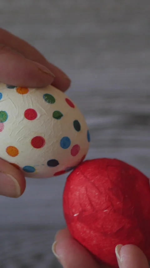 Decorated Eggs Painted Red And Polka-Dotted Patterns Held In Hands,  Stock Footage 302540372