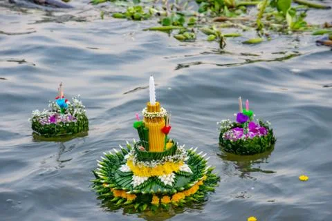 Decorated float made from natural materials on the river. Stock Photos