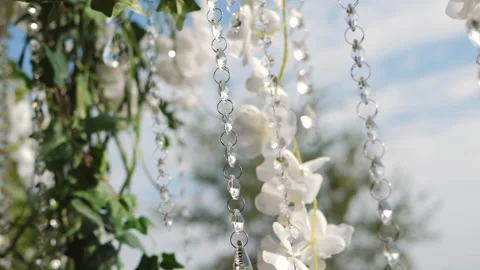 Decorated with flowers and chains wedding ceremony. Romantic decorations jewelry Stock Footage 140811082
