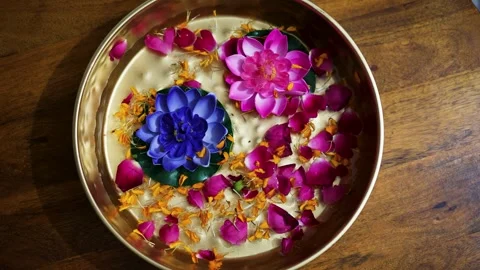 Decorated flowers kept in copper plat at festival at home form top angle Vídeos de archivo 272979979