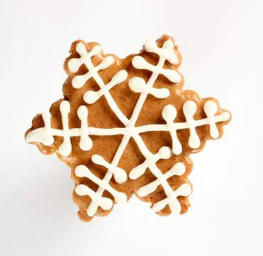 Decorated gingerbread star cookie with white icing 스톡 사진