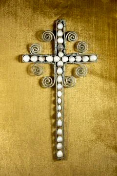 Decorated hand made wire cross and beads Stock Photos